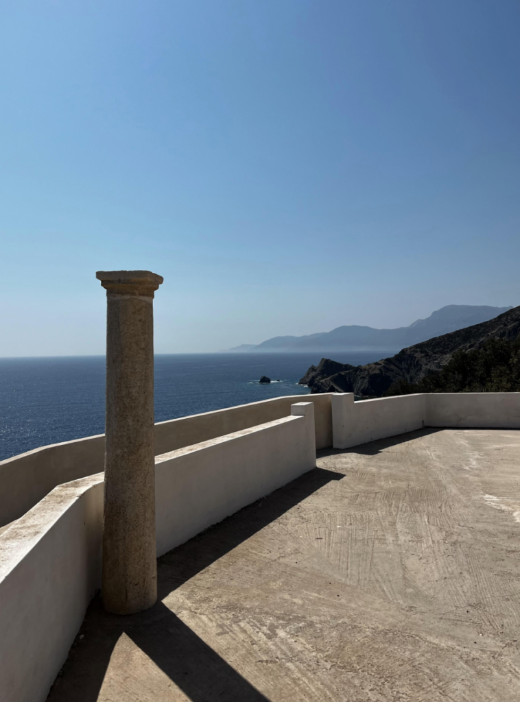 A column overlooking the azure Mediterranean Sea, Karpathos. 