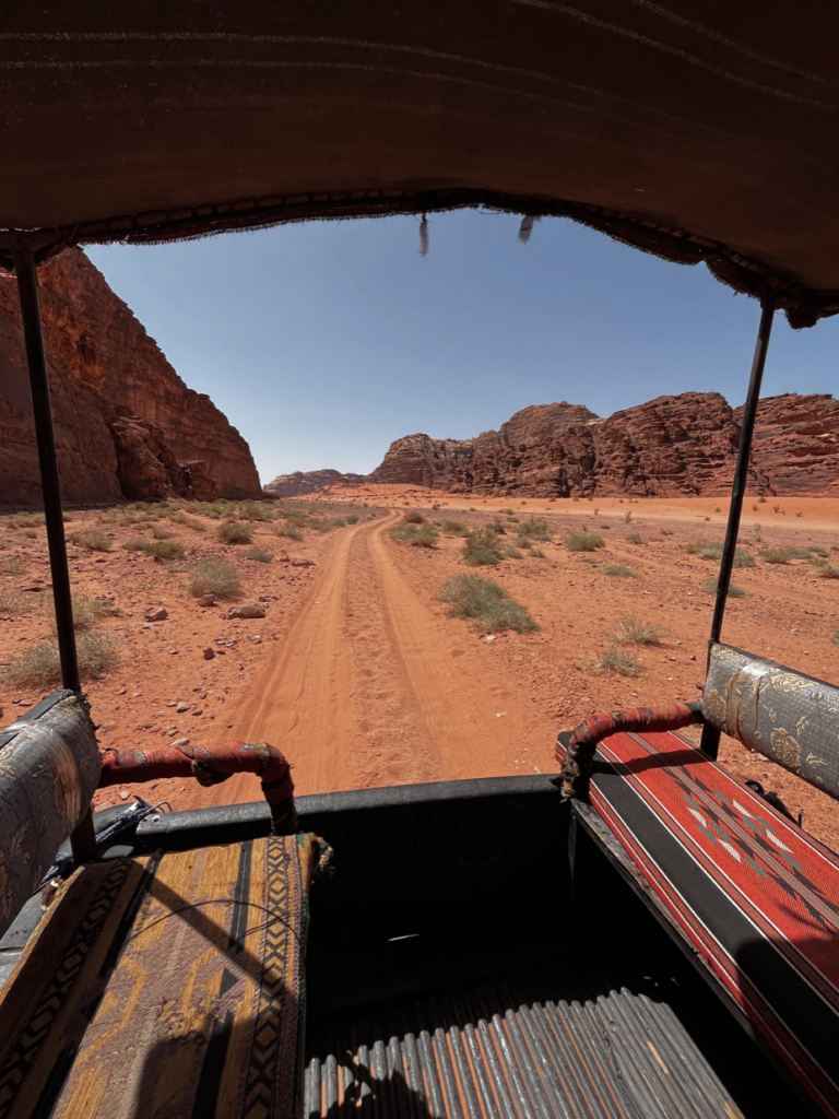 An adventurous ride in the back of a Bedouin covered pickup truck during my day trip to Wadi Rum.