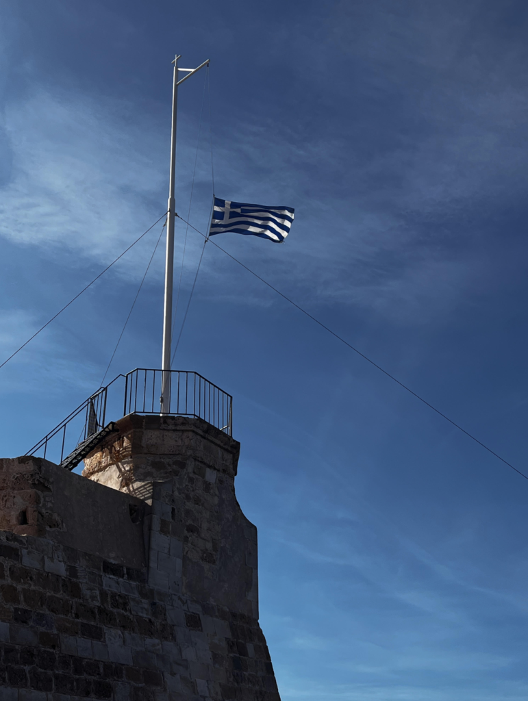 A Greek Flag waves over the Venetian fortress.