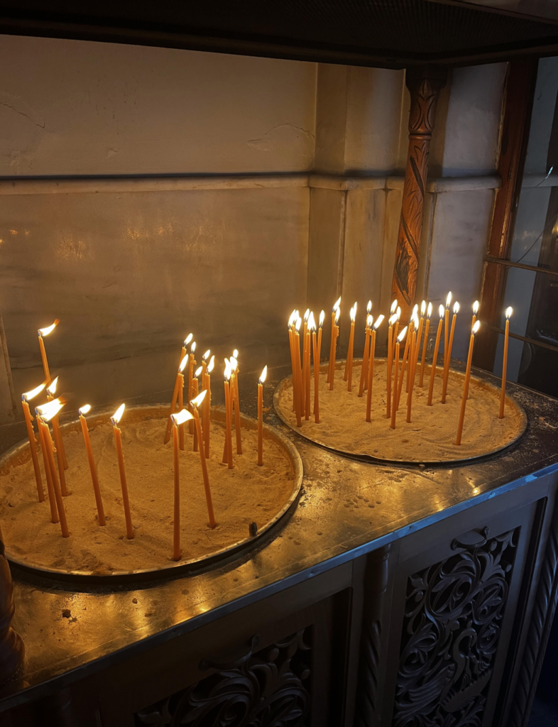 Faithful light prayers at the Presentation of the Virgin Mary Cathedral in Chania Town.