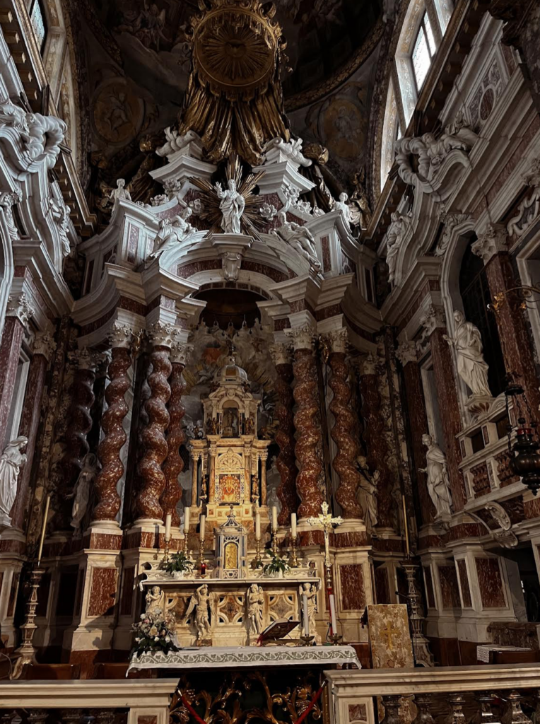 Interior of Santa Maria di Nazareth Church. One of the most ornate churches to see on a day trip to Venice from Rome.