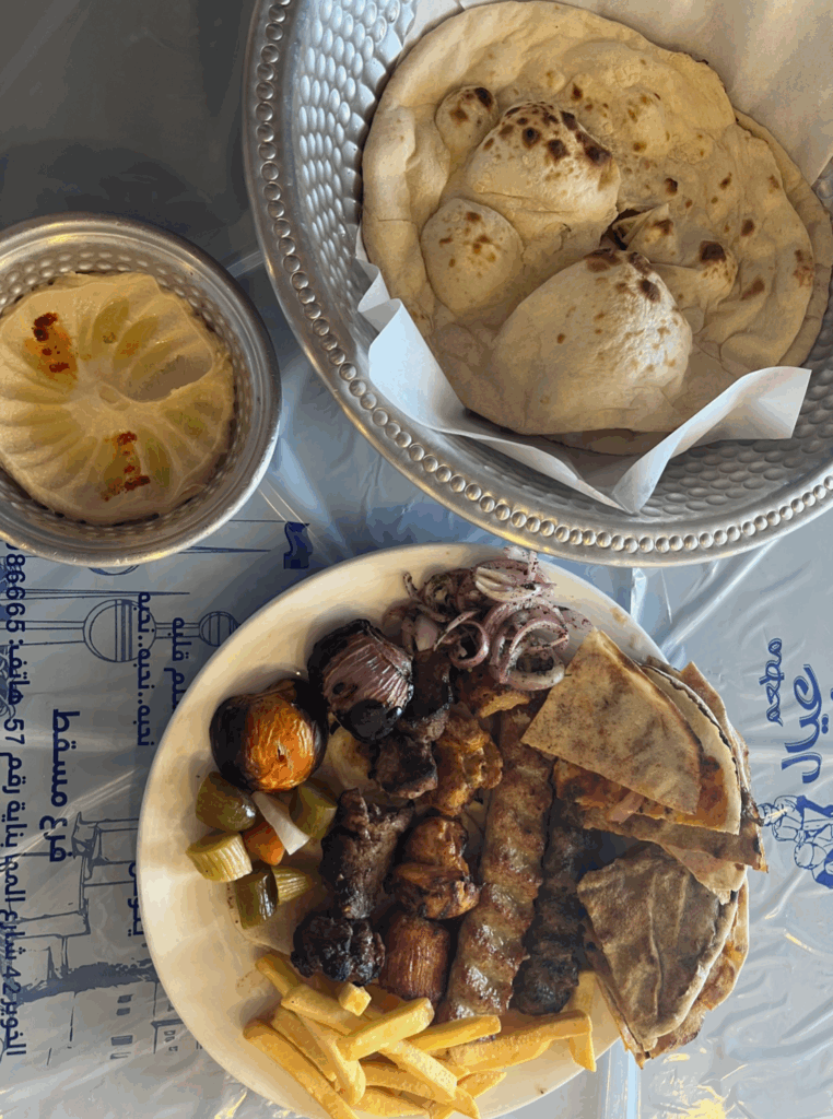 Traditional Omani food. Kebab, bread, and hummus.