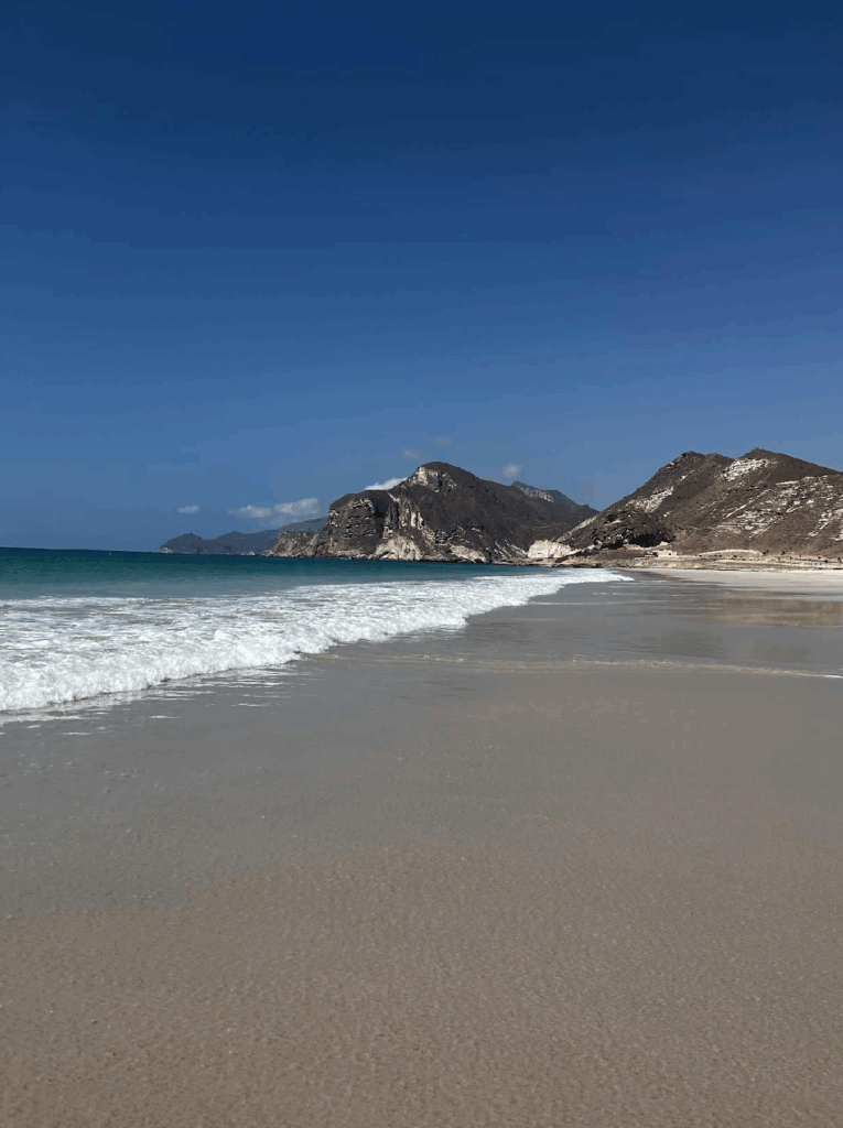 Rugged coastline and pristine beaches in Salalah, Oman.