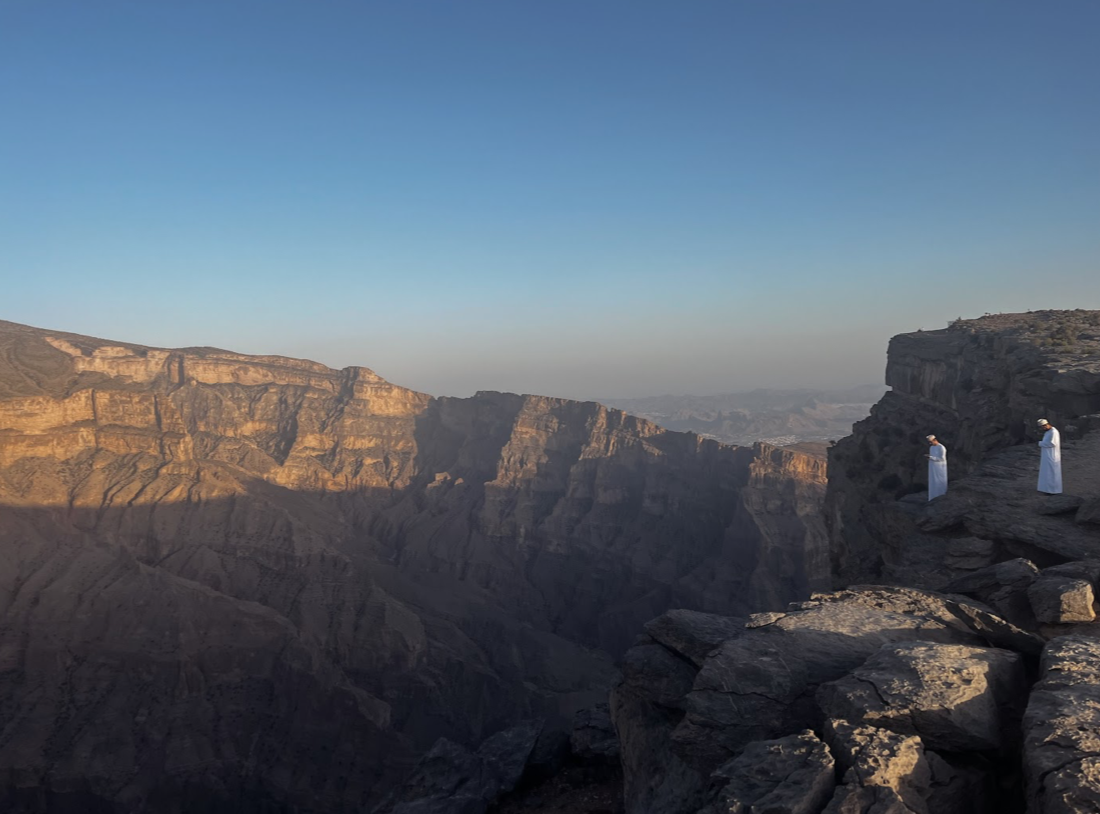 Omani men admiring the view of Jebel Shams