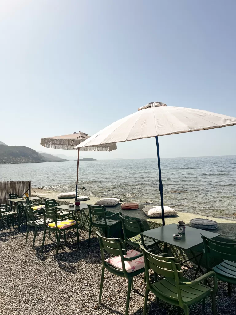 umbrellas and chairs on the waterfront of Agios Nikolaos, Greece